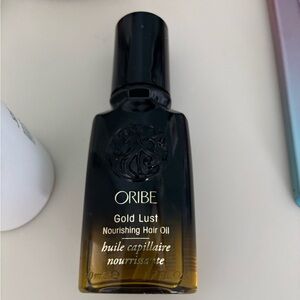 Oribe Gold Lust Hair Oil in Black and Gold